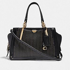 Coach dreamer bag with quilting and rivets.